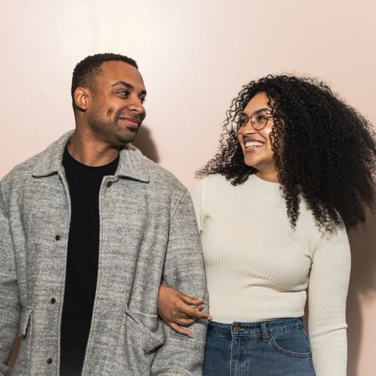 Black Couple Smiling At Each Other