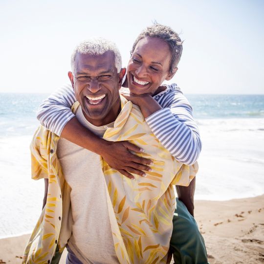 Black Older Couple On The Beach