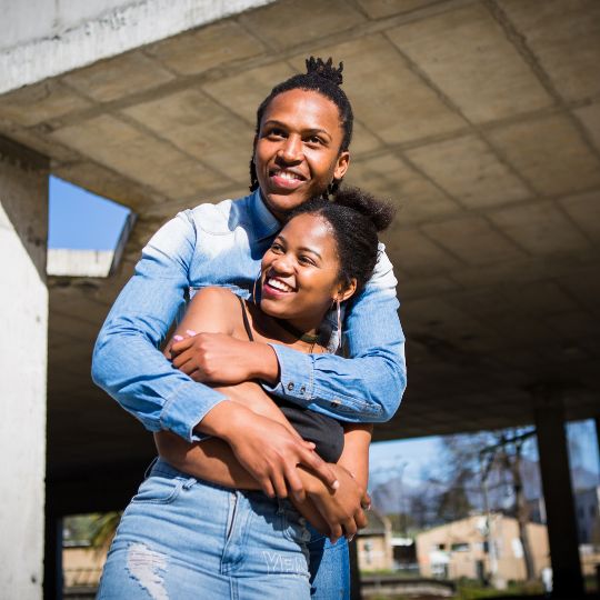 Young Black Couple Hugging